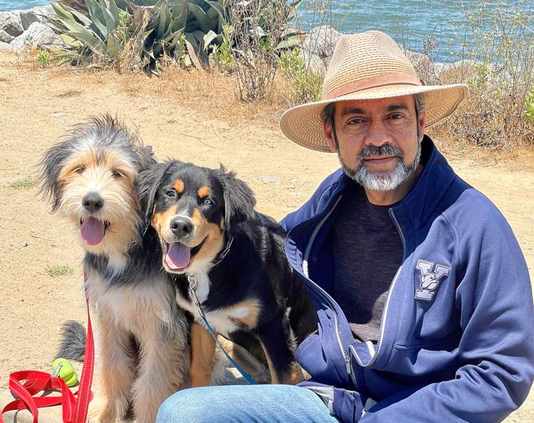 Rahul Prasad ’87 PhD with his two dogs