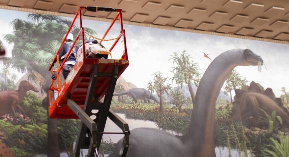Art conservators assess the Peabody Museum's dinosaur mural